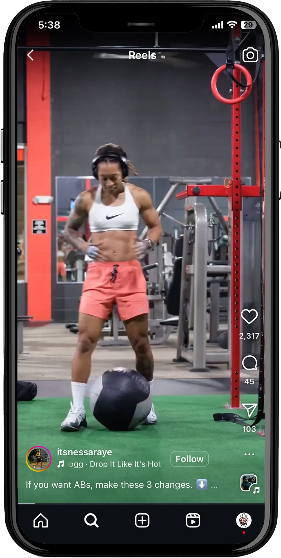 A social media Reels with the username 'Itsnessaraye' and text: 'A cgg Drop It Like It's Hot.' Below, a call-to-action says 'Follow' alongside a fitness tip: 'If you want ABs, make these 3 changes.