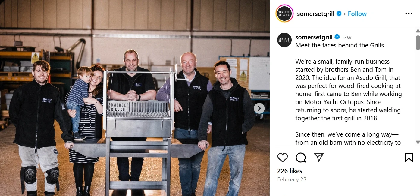 Somerset Grill's Instagram post featuring the team behind their handcrafted wood-fired grills. The photo showcases the family-run business founders and their commitment to quality, craftsmanship, and innovation in grill making.